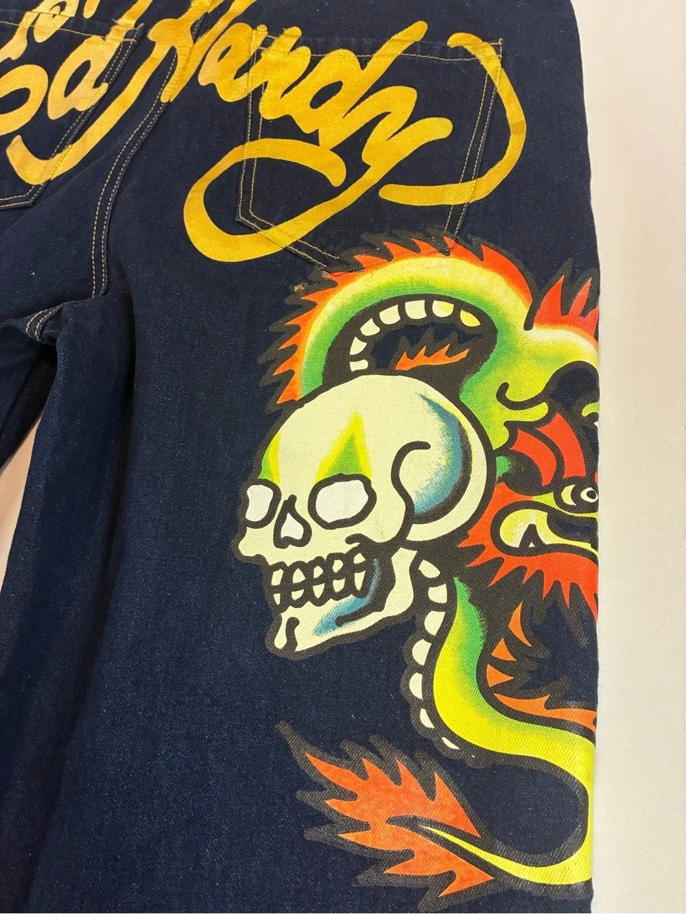Ed Hardy Dark Blue Jeans with Yellow Script and Neon Skull Artwork